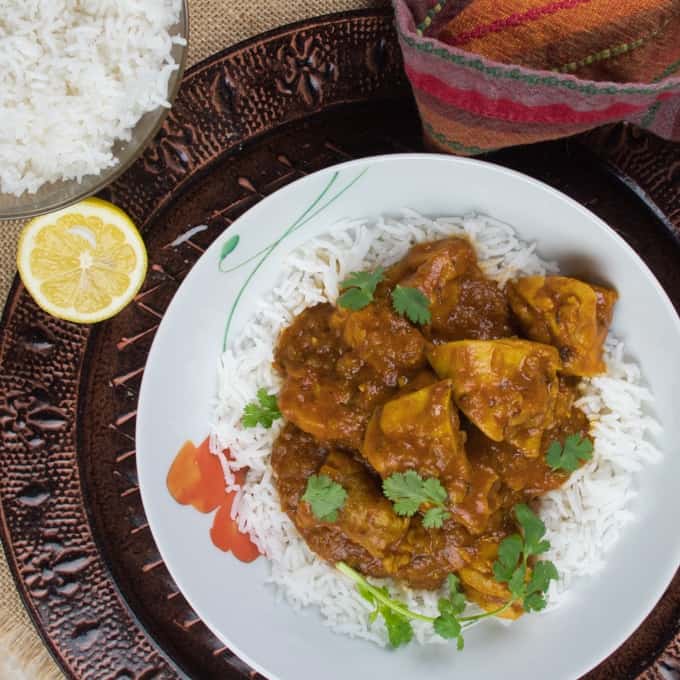 Easy Peasy Weeknight Curry Served with rice and showered with bright green cilantro and a wedge of lemon..