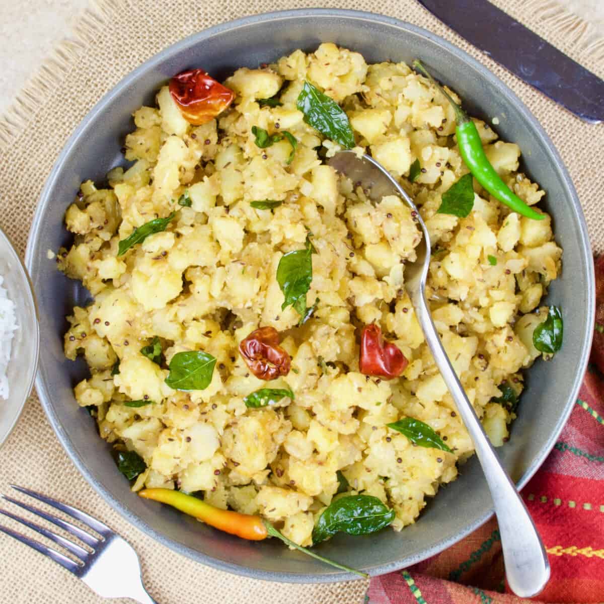 Potato masala all dished up an garnished with fresh green chillies and cilantro.