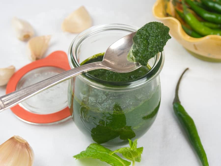 Green Chutney - 3 Easy Recipes All bright green and stored in a pretty lidded jar.