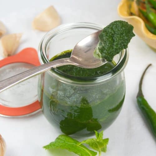 Green Chutney - 3 Easy Recipes All bright green and stored in a pretty lidded jar.