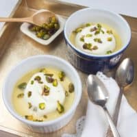 Sweet & Creamy Chai Pudding - Served with a cloud of whipped cream and a shower of pistachios and candied rose petals.