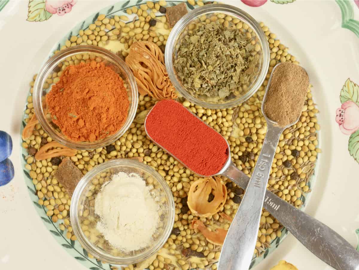 Tandoori masala powder on a bed of the individual spices.