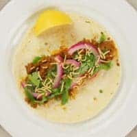 Indian-ish Tacos Two Ways & More ~ Ground Meat Taco with pickled red onions and a slice of lemon
