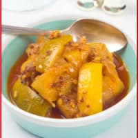 Lemon Pickle Recipe (Nimbu ka Achar) A small serving dish of a mixed lemon and lime pickle with Indian spices