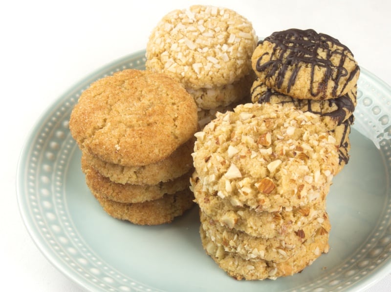 Chewy Coconut Almond Cookies (Gluten Free) plate of cookies dressed up with chocolate, coconut, spiced sugar, and nuts.