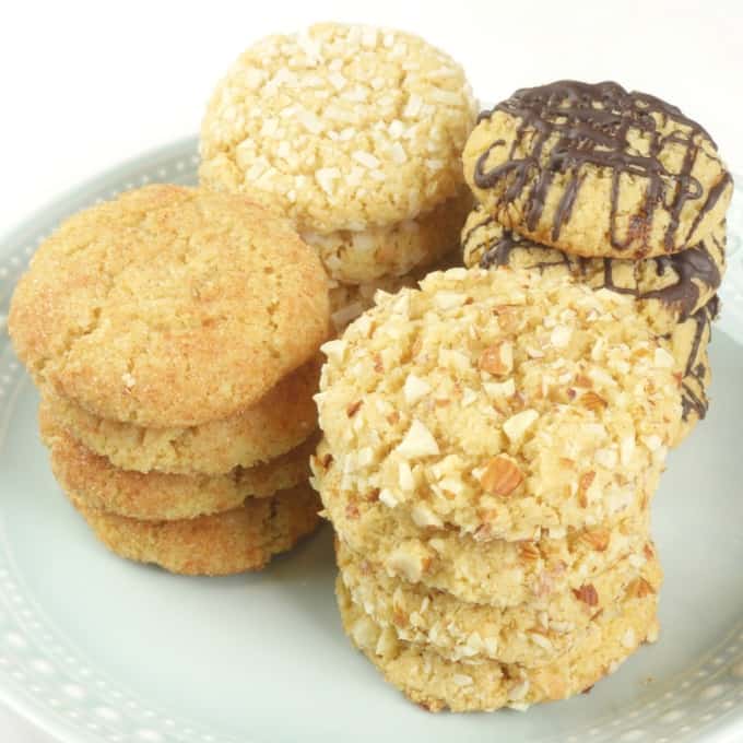 Chewy Coconut Almond Cookies (Gluten Free) plate of cookies dressed up with chocolate, coconut, spiced sugar, and nuts.