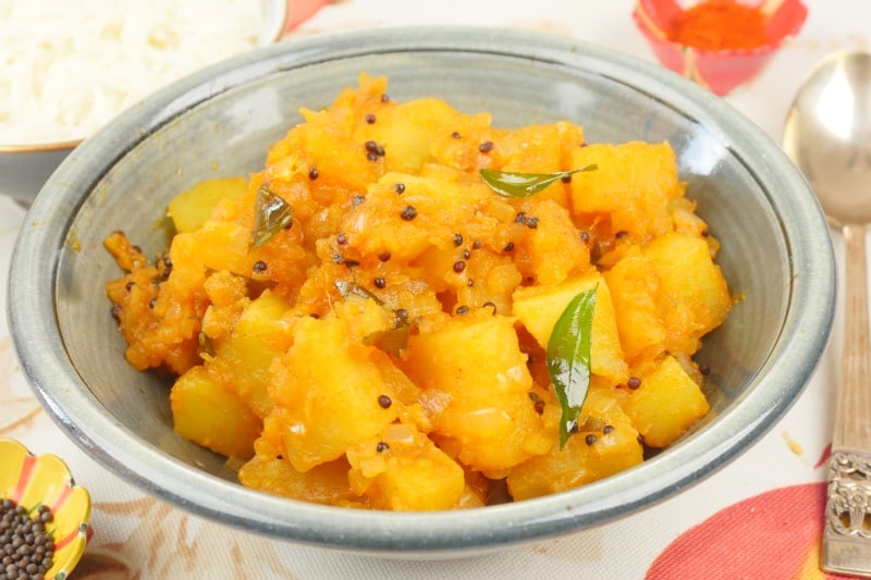 Aloo Masala (Kerala-Style) A beautiful bowl of aloo masala with popped mustard seeds and spluttered curry leaves.