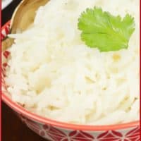 Served in a pretty red and white rice bowl garnished with bright green cilantro.