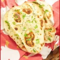 Served in a basket garnished with a flutter of chopped cilantro and sprinkling of onion or nigella seeds.