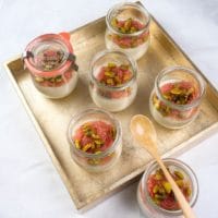 Served in small glass jars and topped with grapefruit and candied pistachios.