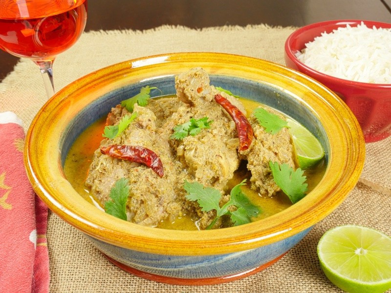Goan Chicken Curry (Xacuti) - Served with a flutter of green cilantro and dried red chilies.