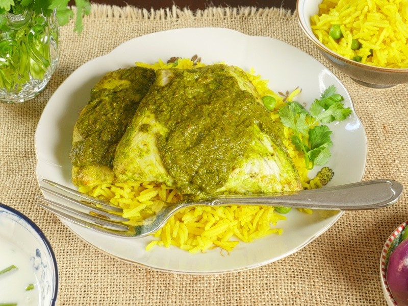 Indian Fish Curry (Recheado) Served on top of Goan rice and drizzled with reduced marinade.