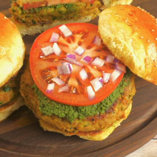 Served burger sized in a soft bun smeared with green chutney, topped with a slice of tomato and chopped red onion.Indian-Spiced Kabab Recipe ~ Served burger sized in a soft fluffy bun smeared with green chutney, topped with a slice of tomato and chopped red onion.