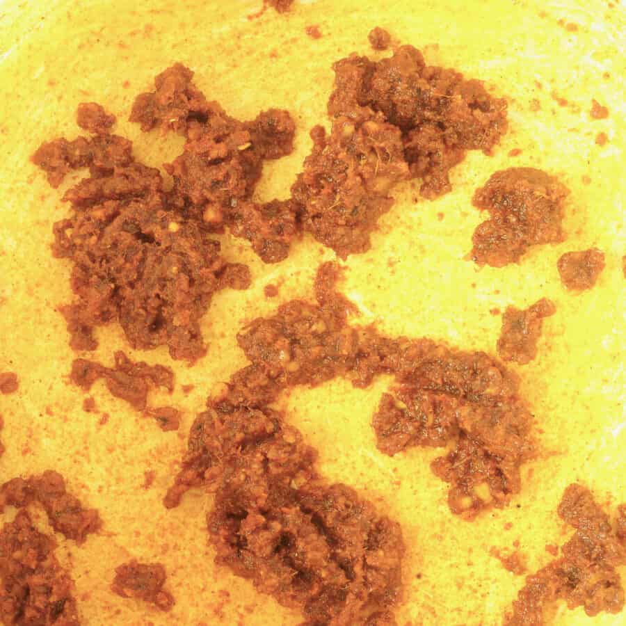 Spices toasting in ghee in a dutch oven..