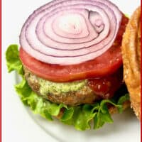 Air Fryer Turkey Burgers served in a bun with a slice of red onion, tomato, ketchup and and mayo